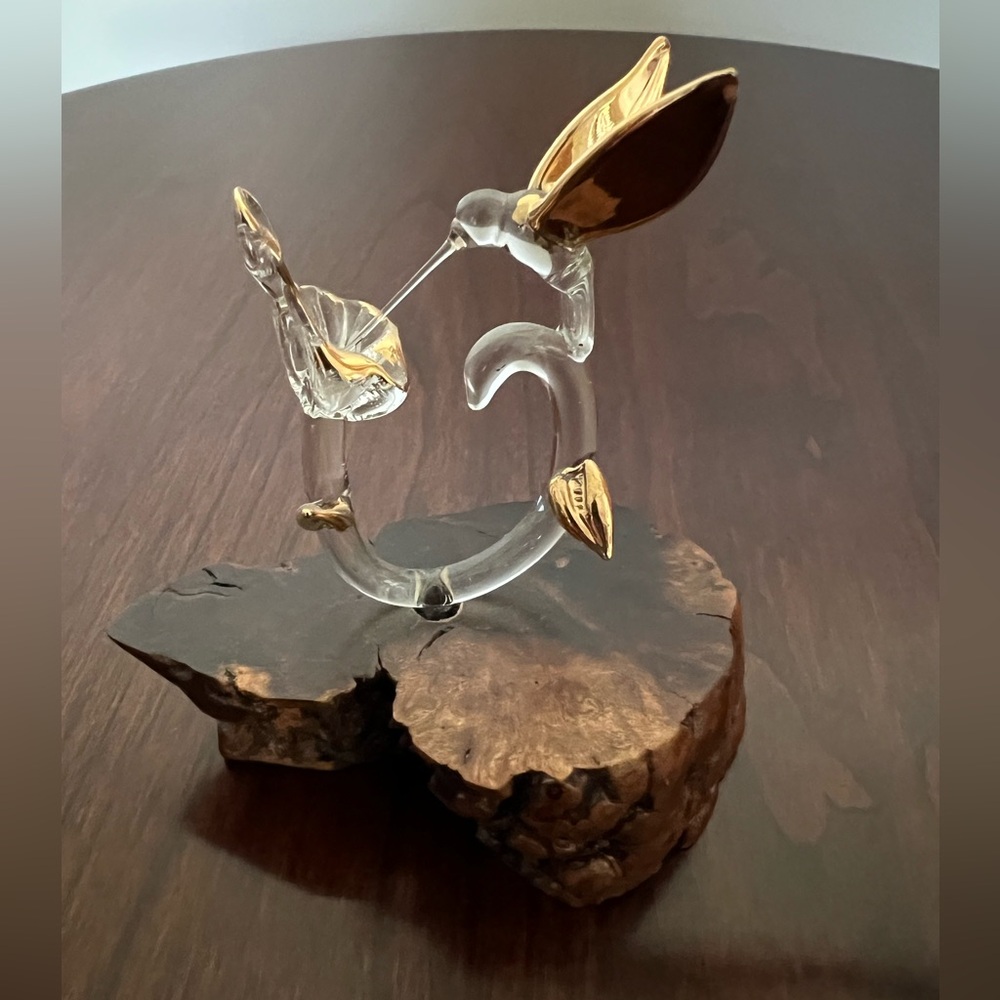 Delicate Hand Blown Glass Hummingbird with Flower mounted on wooden base.